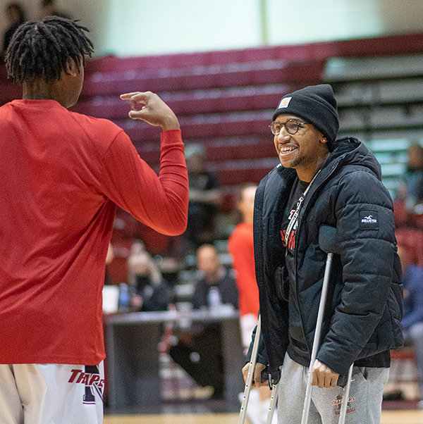Alan Swenson (right) talks with Jerome Mabry before a Northwest College men’s basketball game. Swenson started the year as NWC’s starting point guard before tearing his achilles. He is slated to return to the team next year.
TRIBUNE PHOTO BY CARSON FIELD