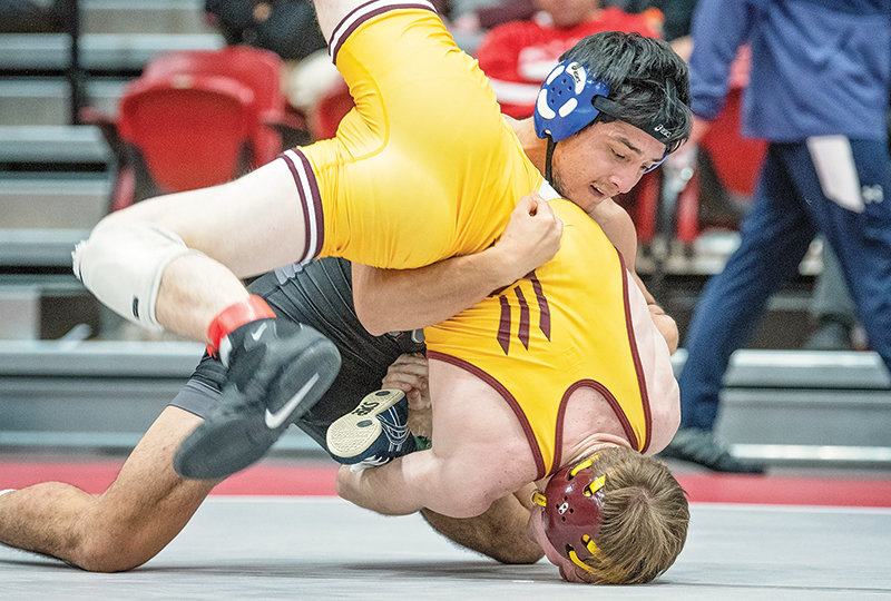 Bobur Birdiyorov takes down his opponent from Montana State-Northern en route to a title at 141 pounds at the Joe Mickelson Memorial Wrestling open in Powell.
TRIBUNE PHOTO BY CARLA WENSKY