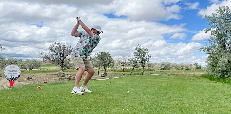 Cody Chamblin of Cody tees off on hole No. 1 during the Trapper Bonanza fundraiser golf tournament at Powell Golf Club Saturday, June 3. Sixteen four-person teams participated in this year’s Scramble format event to support Northwest College athletics.
TRIBUNE PHOTO BY TOBY BONNER