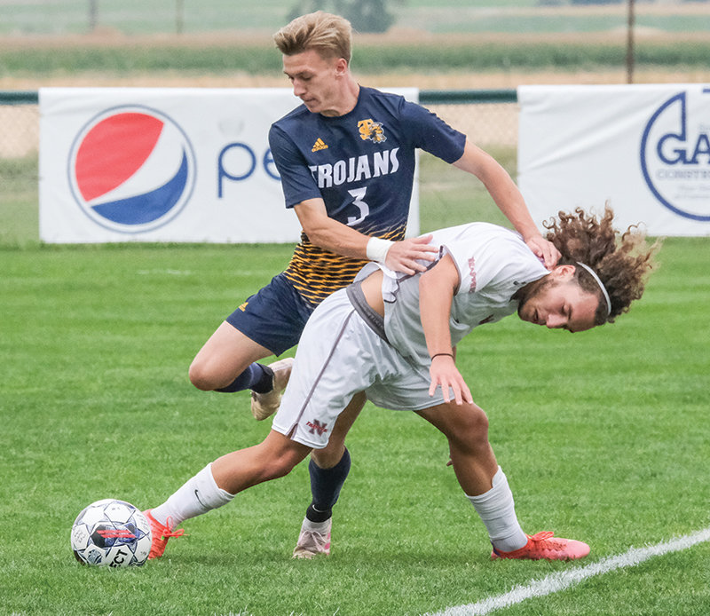 Benjamin Lachaize holds off a Trinidad defender in a home matchup earlier this season. Lachaize and the Trappers head to Casper on Saturday to try and upset No. 20-ranked Casper College.
TRIBUNE PHOTO BY SETH ROMSA