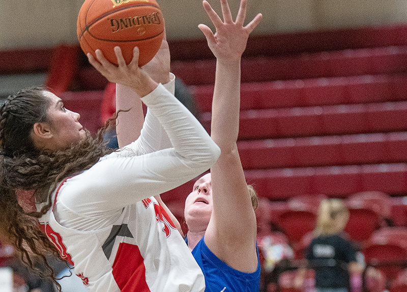 Darla Hernandez puts up a mid-range shot over a Miles Community College defender during the Trappers final home game before break on Dec. 16.
TRIBUNE PHOTO BY CARLA WENSKY