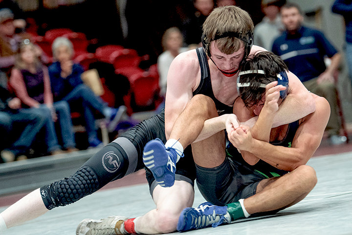 Avery McSpadden holds down his opponent during the Joe Mickelson Memorial Wrestling Open in November. The Trappers head on the road for a top-10 showdown on Friday in Rock Springs.
TRIBUNE PHOTO BY CARLA WENSKY