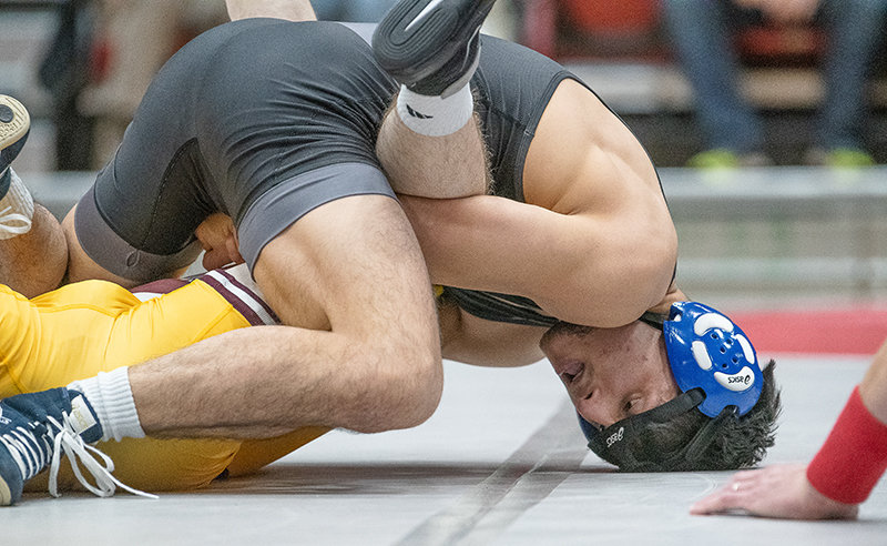 Bobur Berdiyorov holds down his opponent during a dual with Montana State University-Northern on Tuesday. Berdiyorov is the top-ranked wrestler at 141 pounds in NJCAA.
TRIBUNE PHOTO BY CARLA WENSKY