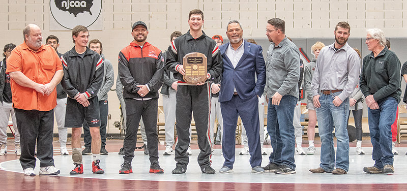 The Apodaca Award is presented to Ryker Blackburn, flanked by former Trapper coaches and award winners during the Apodaca Duals on Friday night. From left: George Laughlin, Brady Lowry, Art Costello, Blackburn, Jim Zeigler, Travis Carter, Bobby Robins and Steve Knopp.
TRIBUNE PHOTO BY CARLA WENSKY