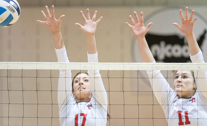 Baylee Peterson (left) and Mollee Krum go for a block Wednesday in the second set of Northwest College’s win over Rocky Mountain College JV. The Trappers are now 6-5 after going 2-1 last week.
TRIBUNE PHOTO BY CARSON FIELD