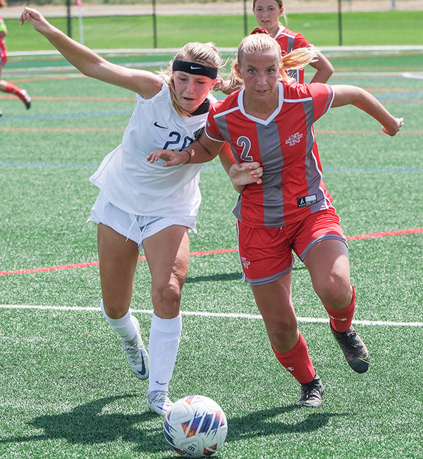 Sophomore Zoey Bonner (right) fights for positioning against a Montana State University Billings midfielder as the Trappers finished up their third game in four days.
TRIBUNE PHOTO BY SETH ROMSA