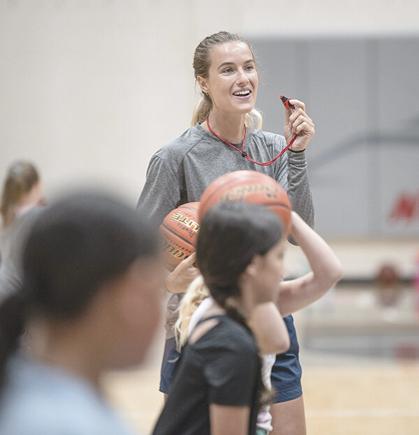Coach Lauren Davis takes a second to laugh during a drill with youth players on Tuesday, June 6.
TRIBUNE PHOTO BY CARLA WENSKY
